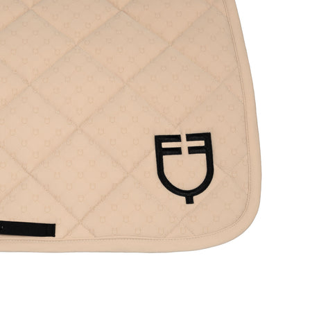 Jumping saddle pad with monogram print
